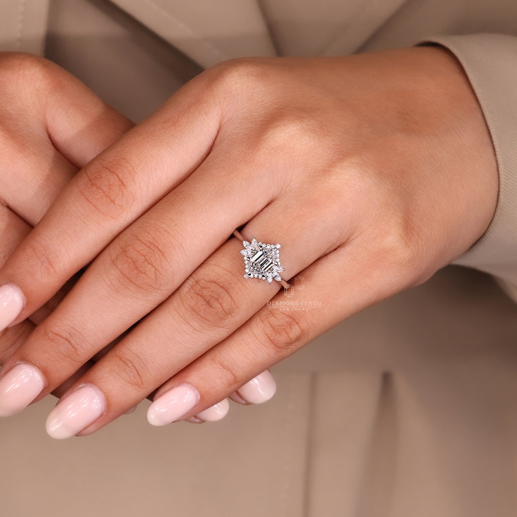 Tapered shank engagement ring with side diamonds.
