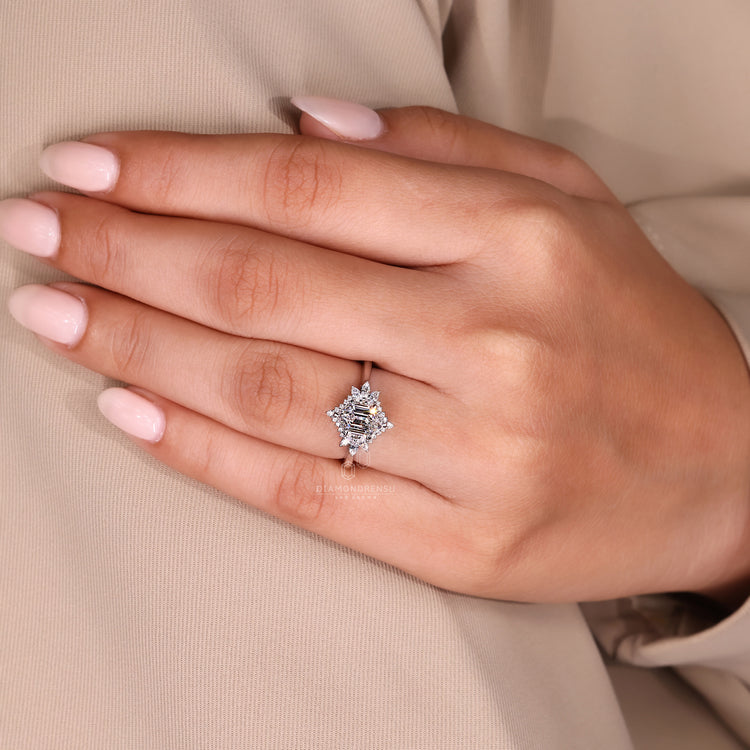 Antique style white gold engagement ring with side stones.
