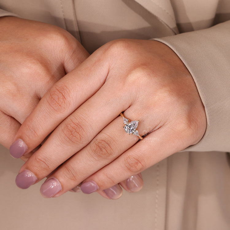 Tapered shank pear cut engagement ring with 3 claw prong setting.
