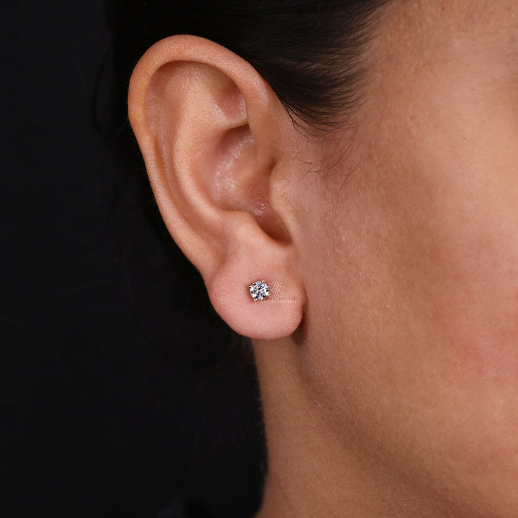 Classic diamond earrings round for an elegant look.
