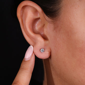 Luxurious gold stud earrings for a refined touch.
