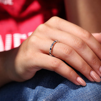Emerald and round eternity band with diamonds.
