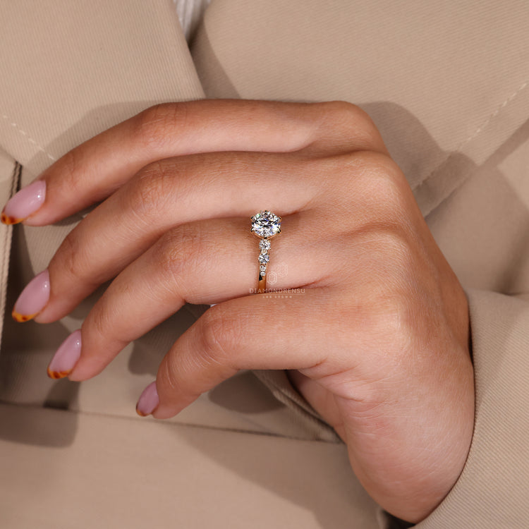 Yellow Gold Engagement Ring with side stones and six claw prong setting.
