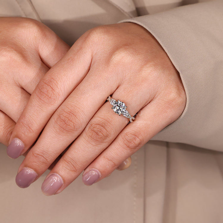 IGI certified round cut engagement ring with three stone style.
