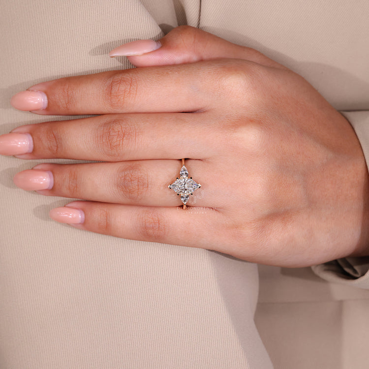 Handmade jewelry featuring Dutch marquise ring, V prong setting, and two pear cut side stones in a custom engagement ring.
