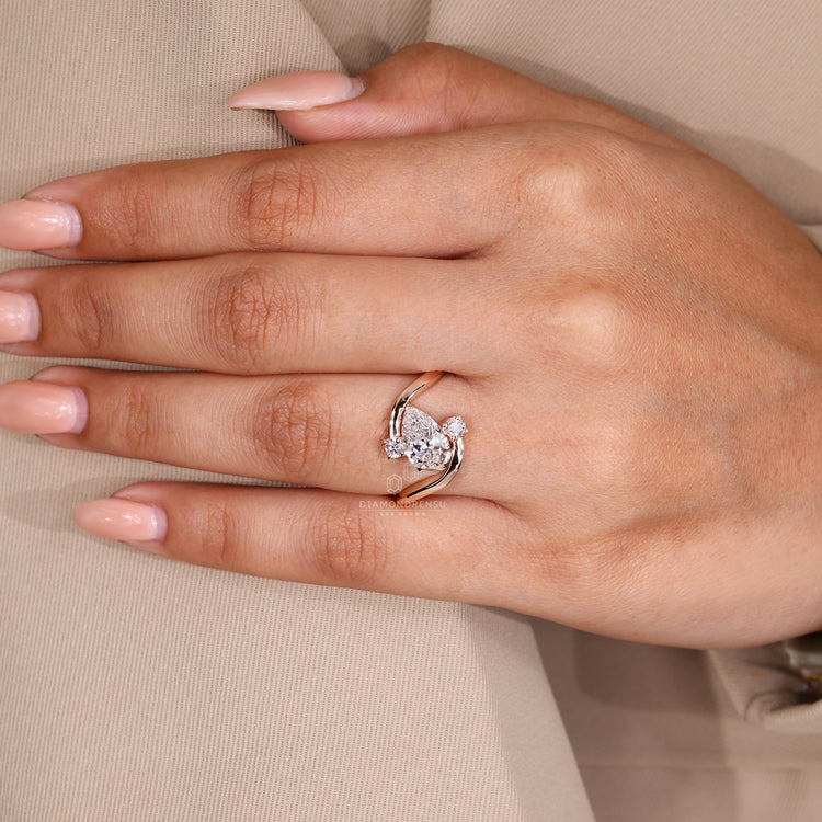 Handmade jewelry including pear diamond ring.
