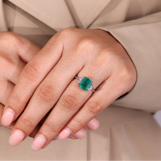 Half moon side stones engagement ring with tapered shank.
