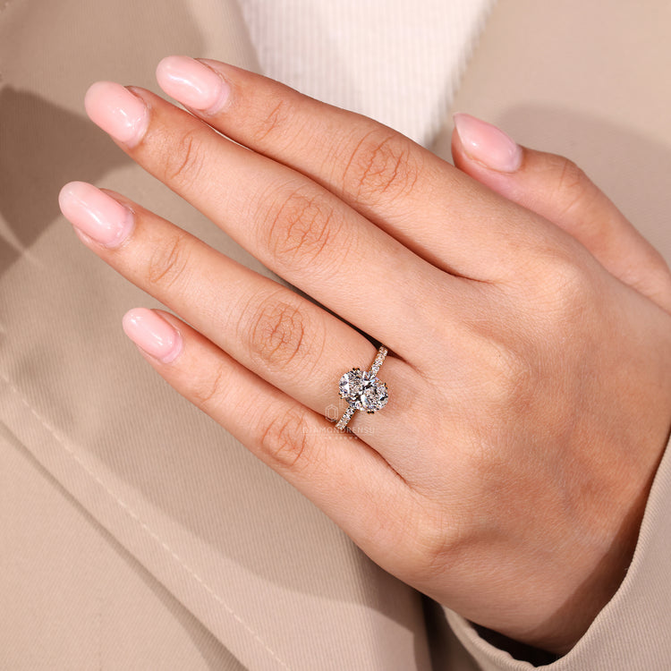 Pave setting ring with oval diamond and handmade precision.
