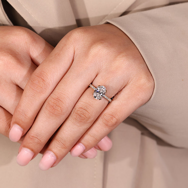 Handmade jewelry featuring oval diamond, hidden halo, and double claw prongs.
