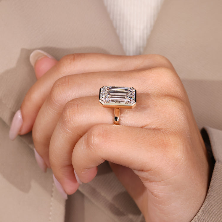 Cathedral setting emerald cut diamond ring.
