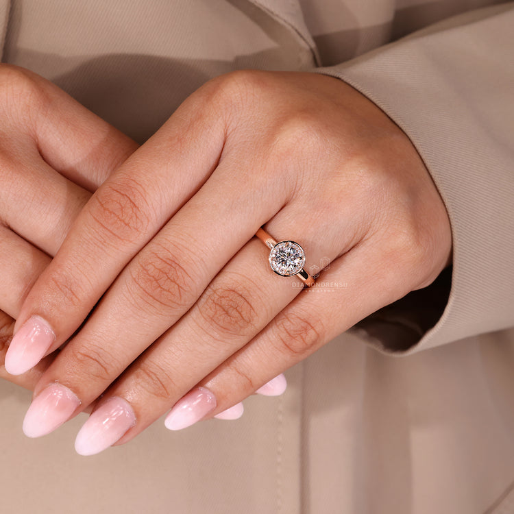 Lab Grown Diamond engagement ring with round cut center and halo setting.
