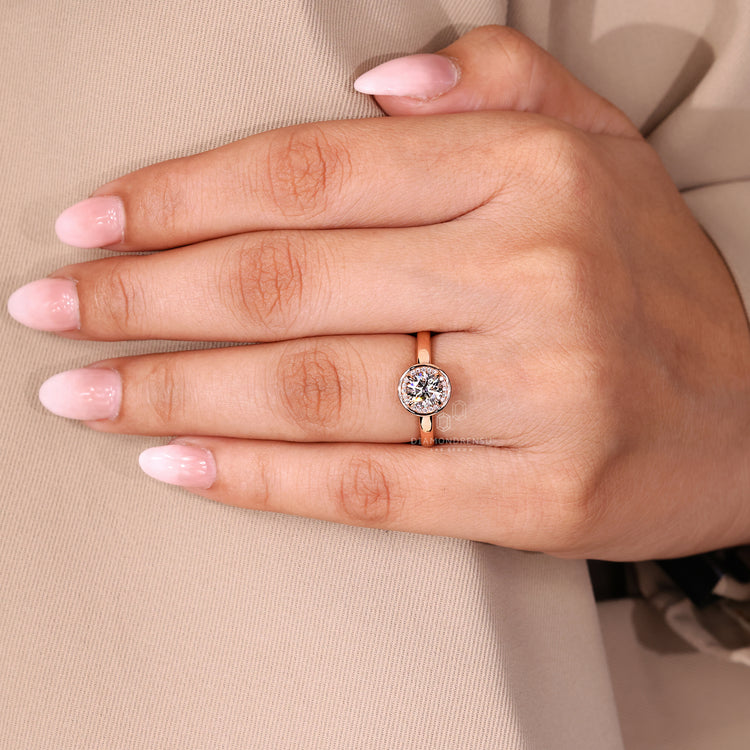 Diamondrensu engagement ring featuring round cut center, halo, and handmade craftsmanship.