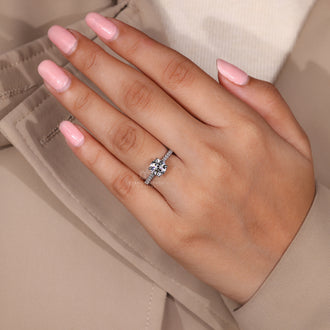 Lab grown diamond ring with 4 prong setting and pave details.
