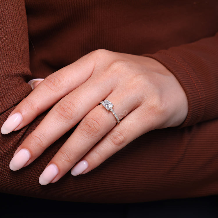 Round cut diamond ring set in a cathedral setting for a timeless design.
