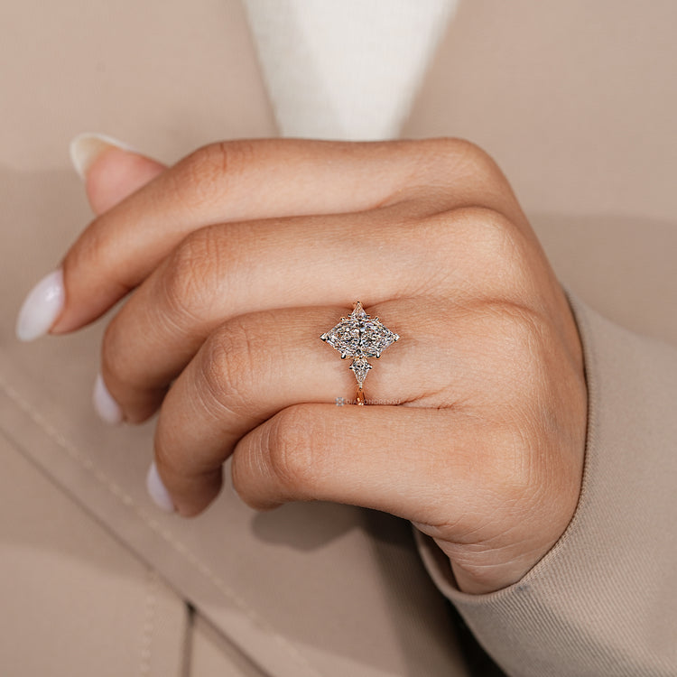 Lab grown diamond trilogy ring with a Dutch marquise center stone.