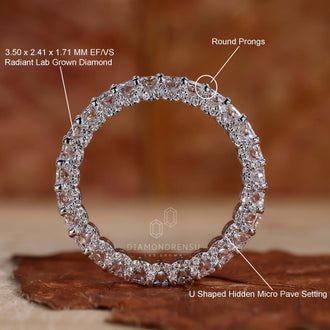 Radiant cut ring with round prong and u-shaped pave setting on a model