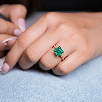 Buy custom asscher cut emerald engagement ring online.