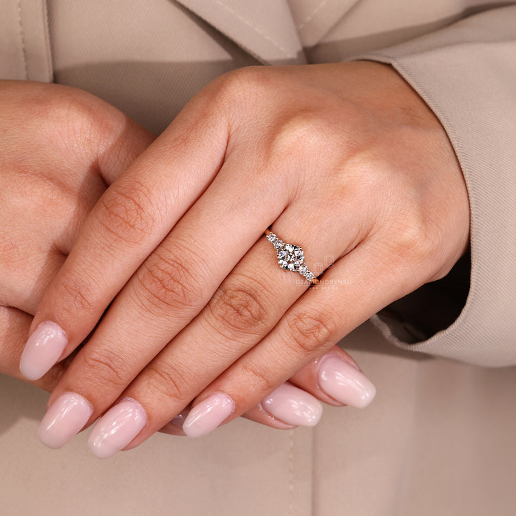Round old european cut diamond ring with tapered band design.