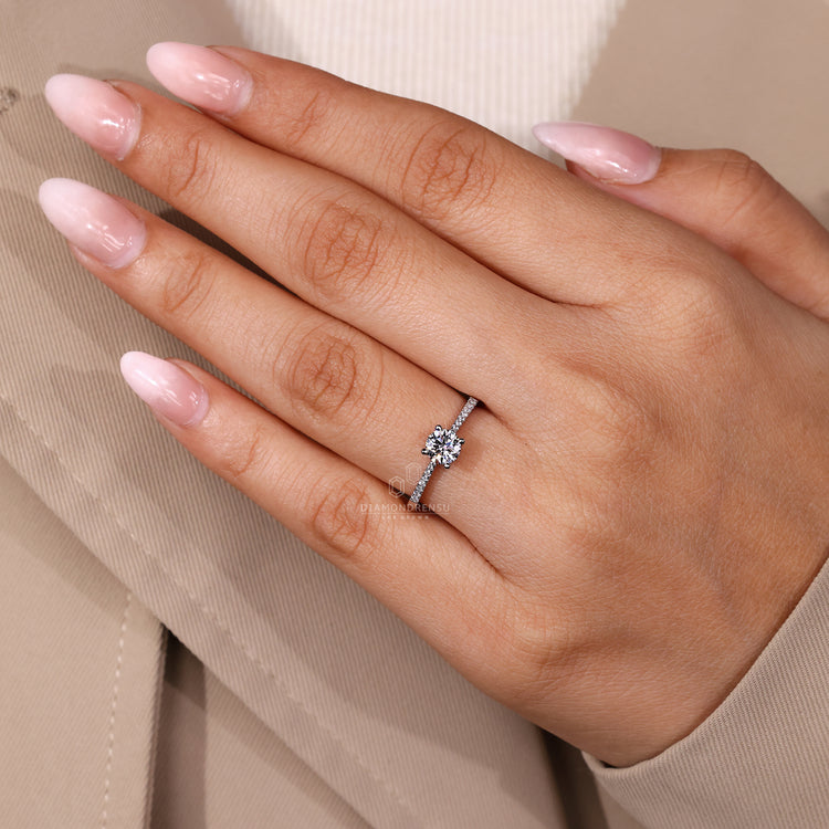 Round diamond ring with tapered shank and IGI certification.