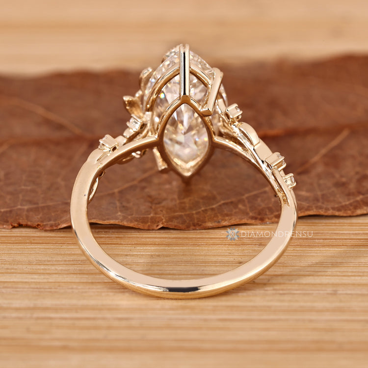 Lab grown marquise diamond ring with leaf prong setting.