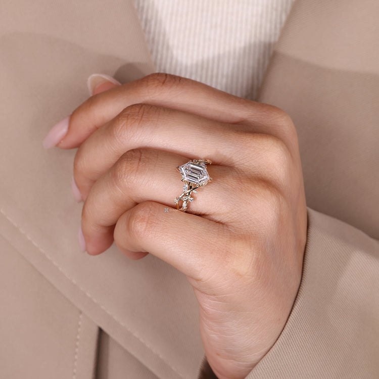 Hexagon center stone ring with marquise and round diamond accents.