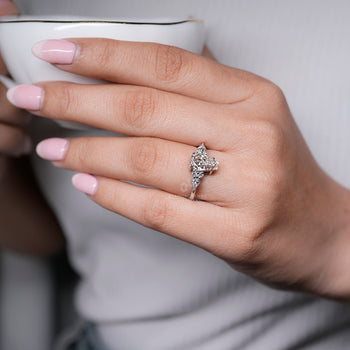 Handmade coffin engagement ring with muse setting.