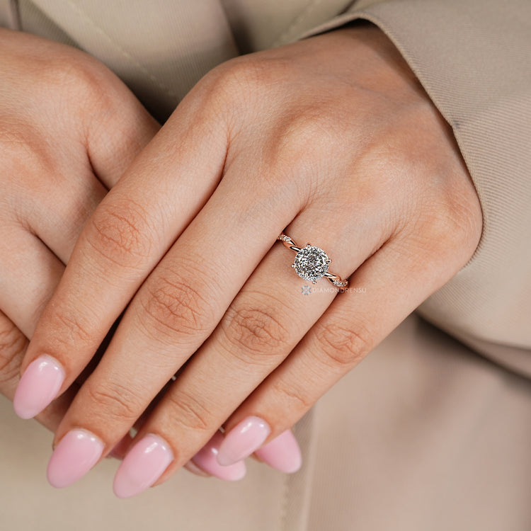 Hidden halo with a round diamond pairs with the four prong setting.