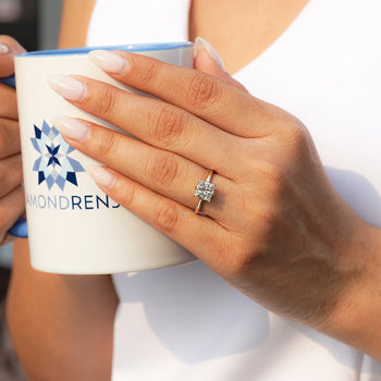 Princess cut lab grown diamond ring with four claw prongs.