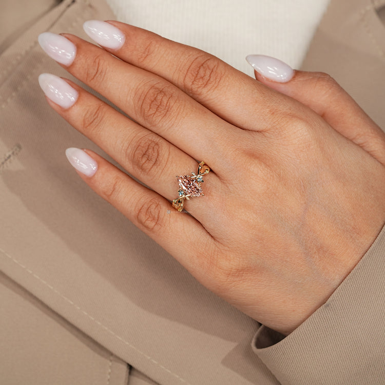 Marquise diamond ring with leaf style prong setting.