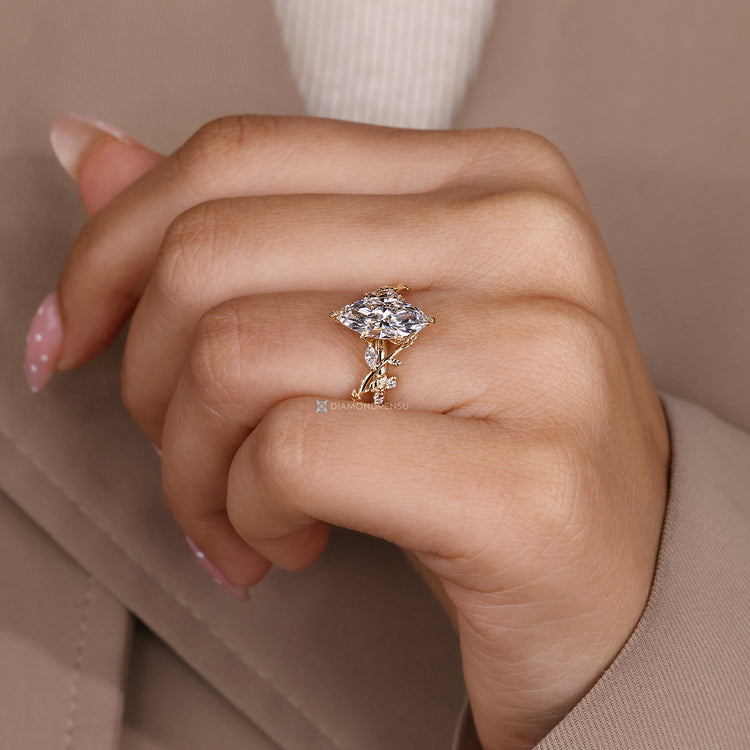 Handmade engagement ring with filigree details and cathedral setting.