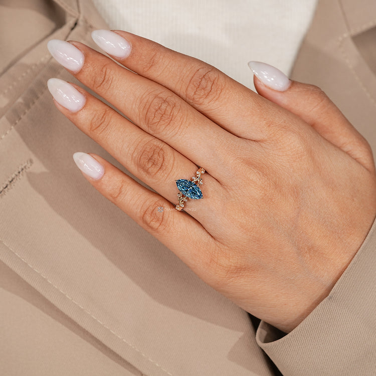 Lab grown diamond blue marquise engagement ring.