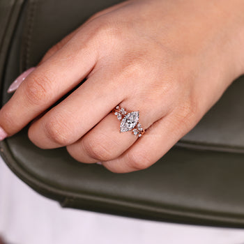 Handmade marquise ring with cluster style and side stone details.