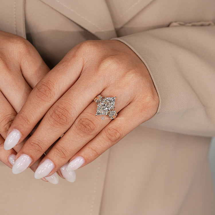 Dutch marquise engagement ring with a hidden halo and round stones.