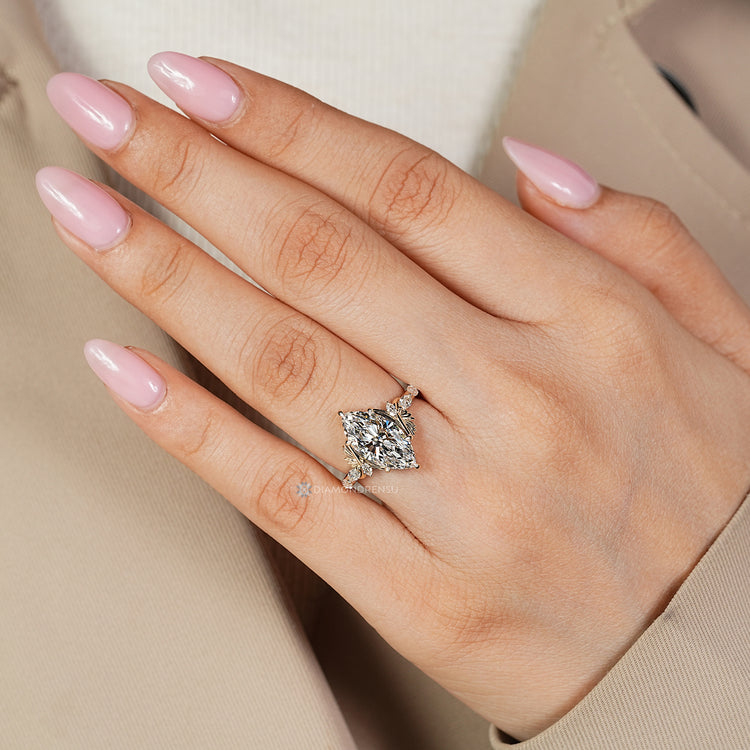Art Deco complements this marquise cut diamond ring.