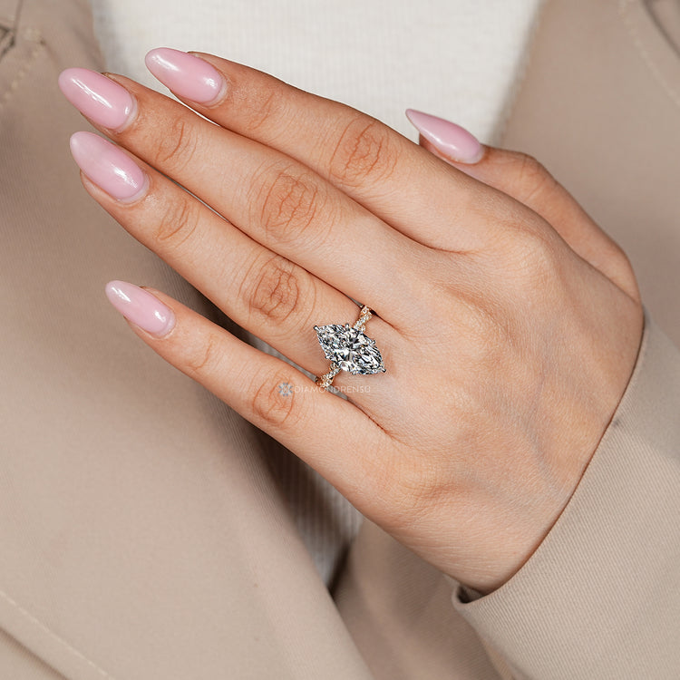 IGI certified lab grown diamond complements the two tone style.