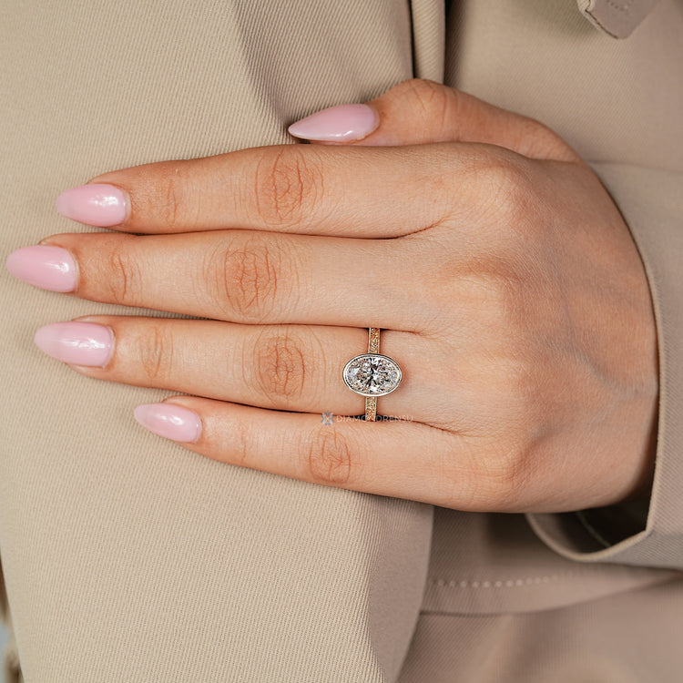 Handmade oval diamond ring with Art Deco details.