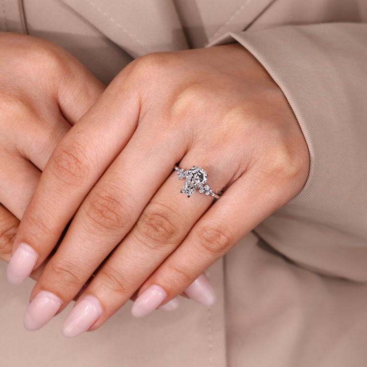 Lab grown diamond ring with coffin center and cluster style.