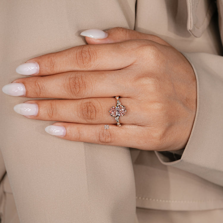 IGI certified oval engagement ring with pink center diamond.