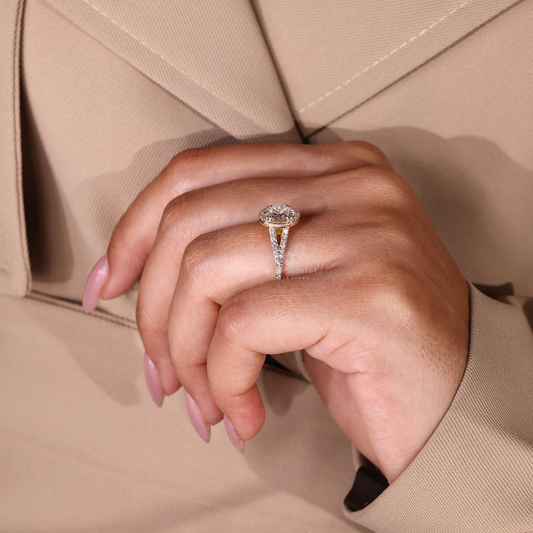 Lab grown oval diamond ring with round bridge accent detail.