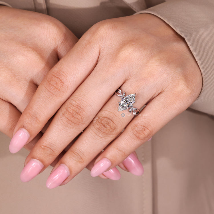 Handmade marquise ring with twisted band and prong setting.