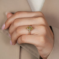 Tulip setting holds the yellow Dutch marquise diamond.
