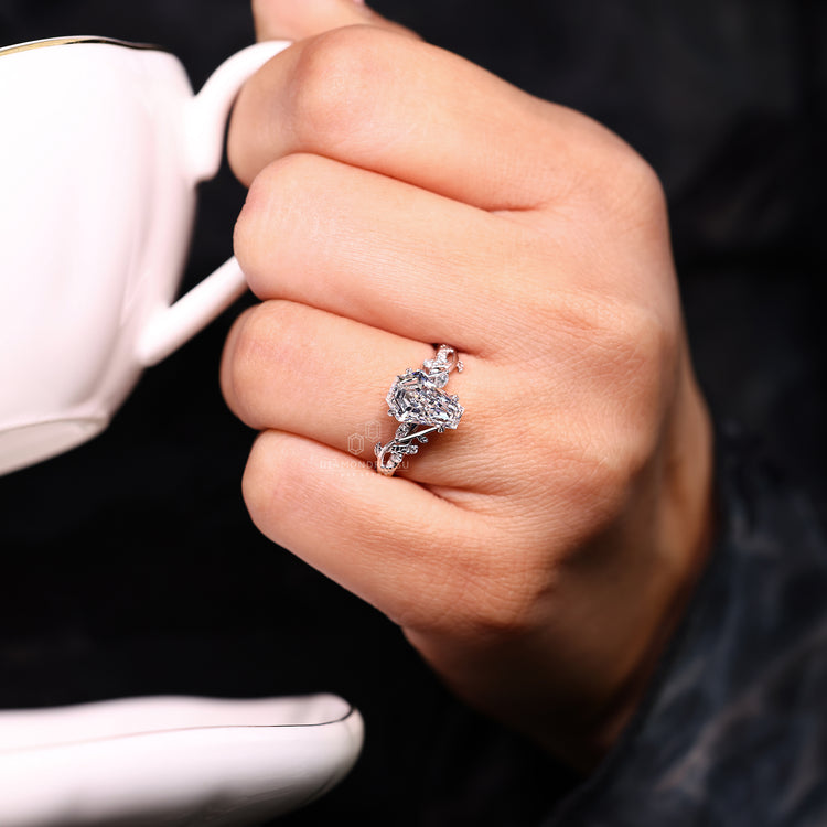 Handmade engagement ring with twisted shank and cathedral setting.