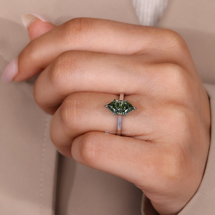 Lab grown green diamond ring with cathedral setting.