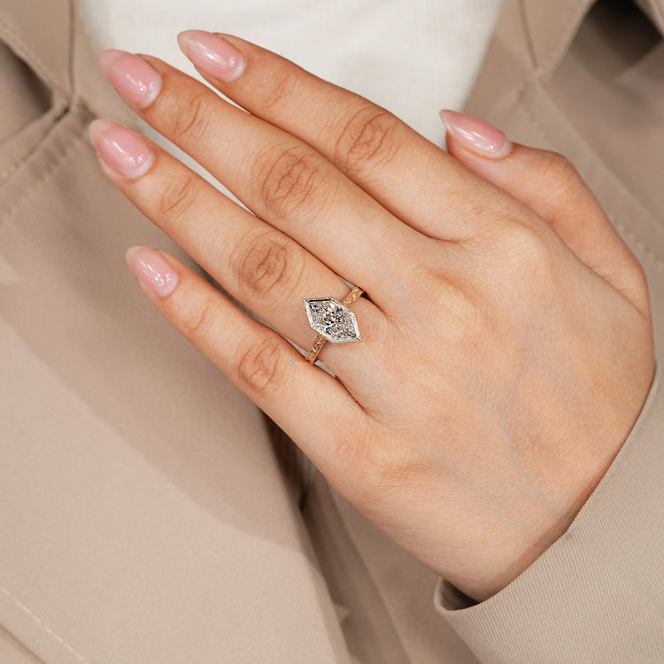 Vintage style Art Deco engagement ring with milgrain details.