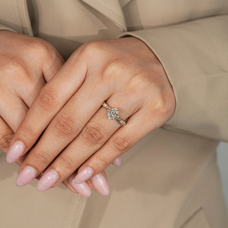 Vintage oval diamond ring with four claw prong setting.
