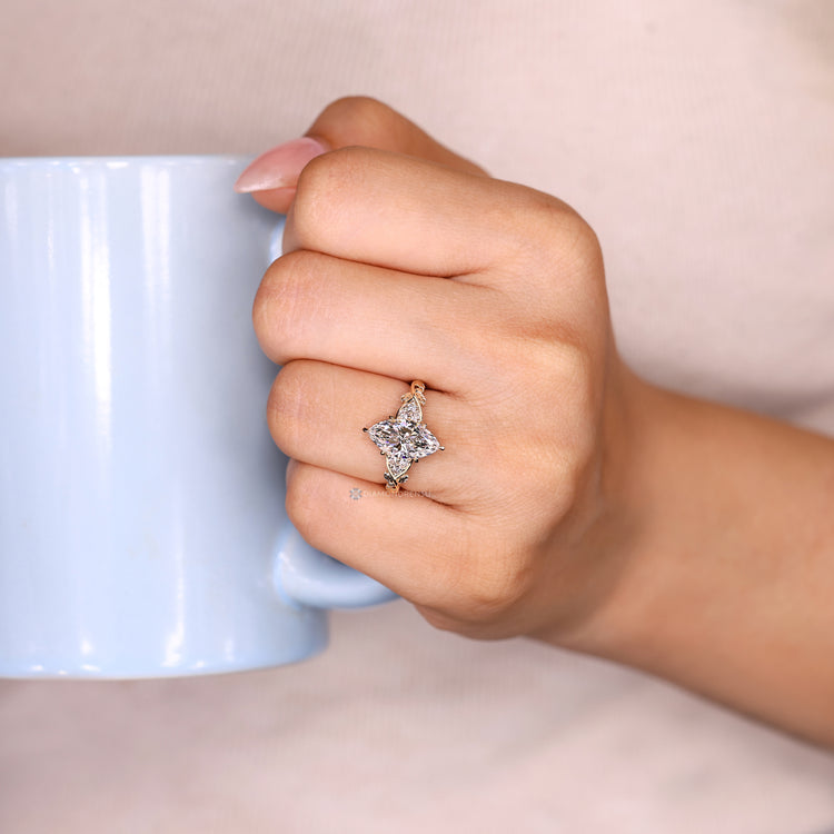 Handmade marquise engagement ring with six claw prong setting.