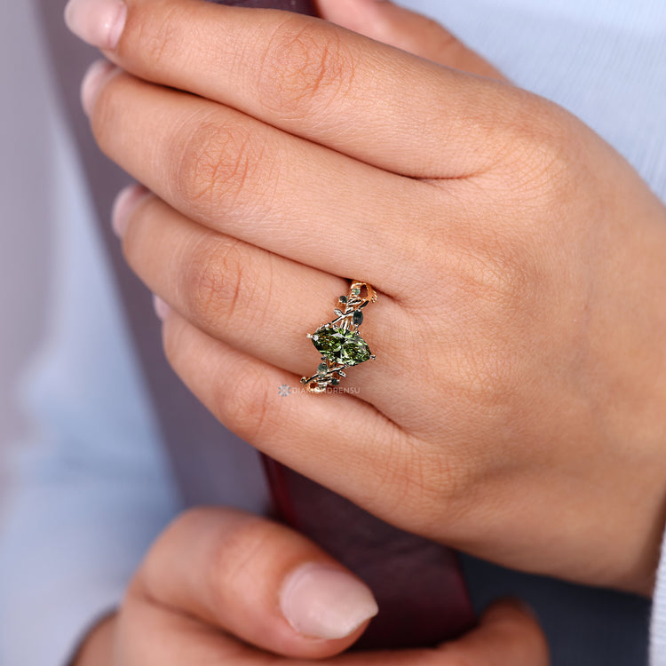 Handmade green marquise engagement ring with Euro shank.