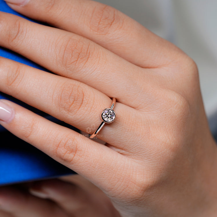 IGI certified round diamond ring with full bezel setting.