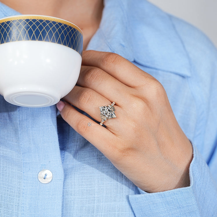 Pave with marquise stones enhances the marquise cut diamond ring.