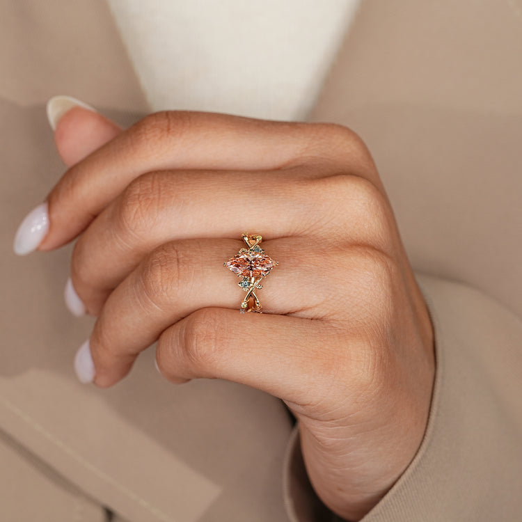 Nature inspired marquise diamond ring with flower design.